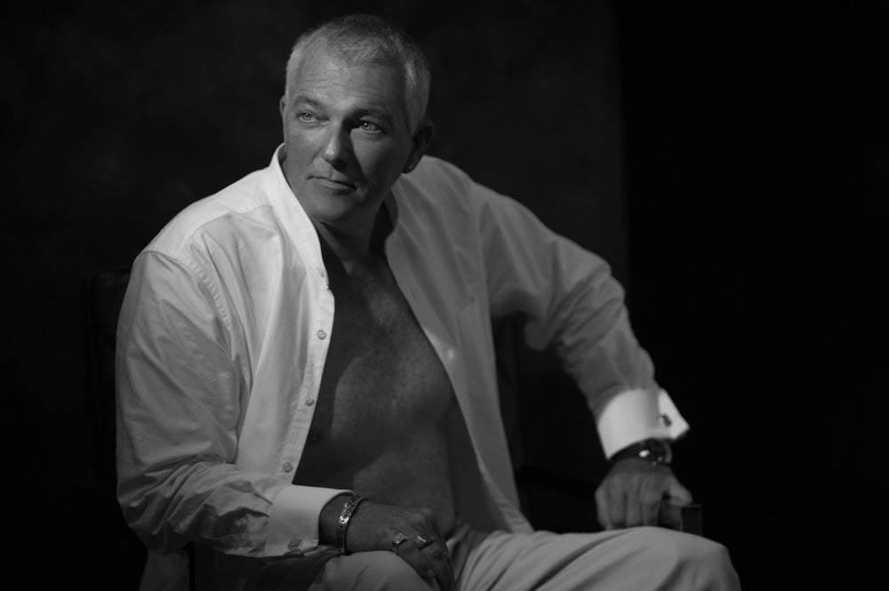 Mature man posing in black and white portrait