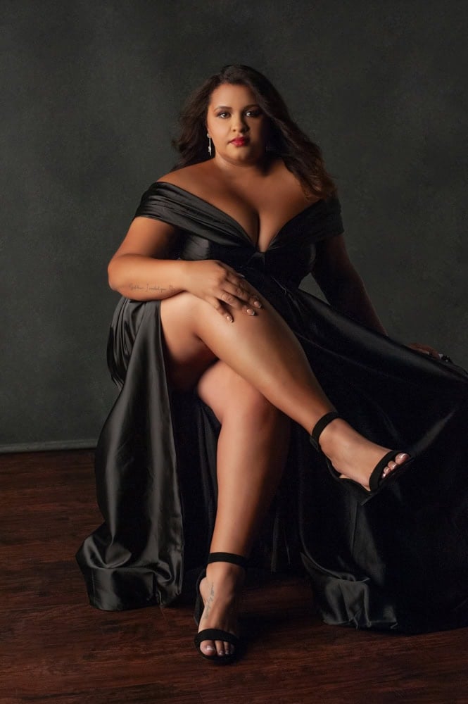 Woman in an elegant black gown during a fine art portrait experience with Olivia Womack Photography